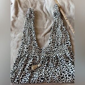 Black and white leopard spotted joggers featuring a smocked elastic waistband